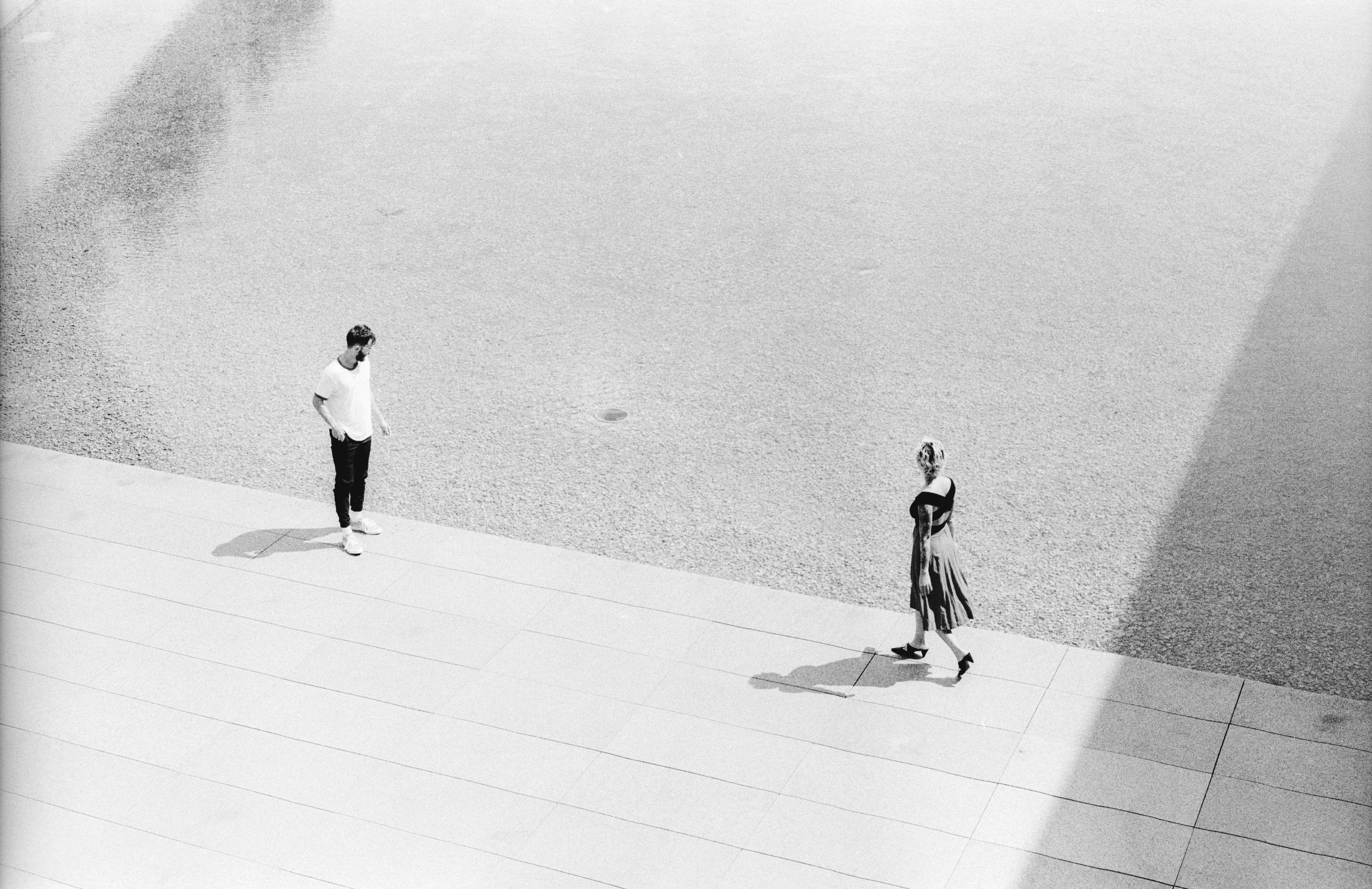 two friends gather near the water at a museum